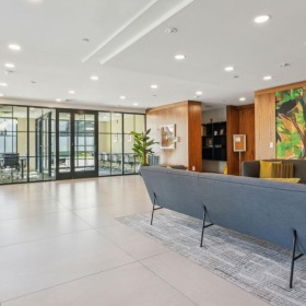 Elegance everywhere you look a large room with a large glass wall and a large glass table