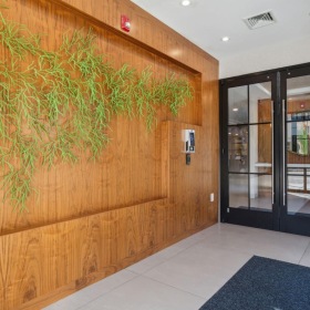 The essence of exceptional living a room with a wood wall and glass doors