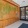 a room with a wood wall and glass doors