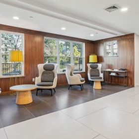 All the comforts of luxury living a large living room with a large window