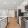 a kitchen with white cabinets