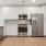 a kitchen with white cabinets
