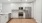 a kitchen with white cabinets