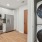a kitchen with white cabinets